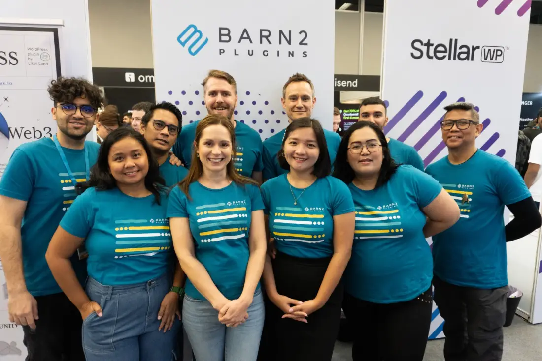 The Barn2 team at their booth at a WordCamp event